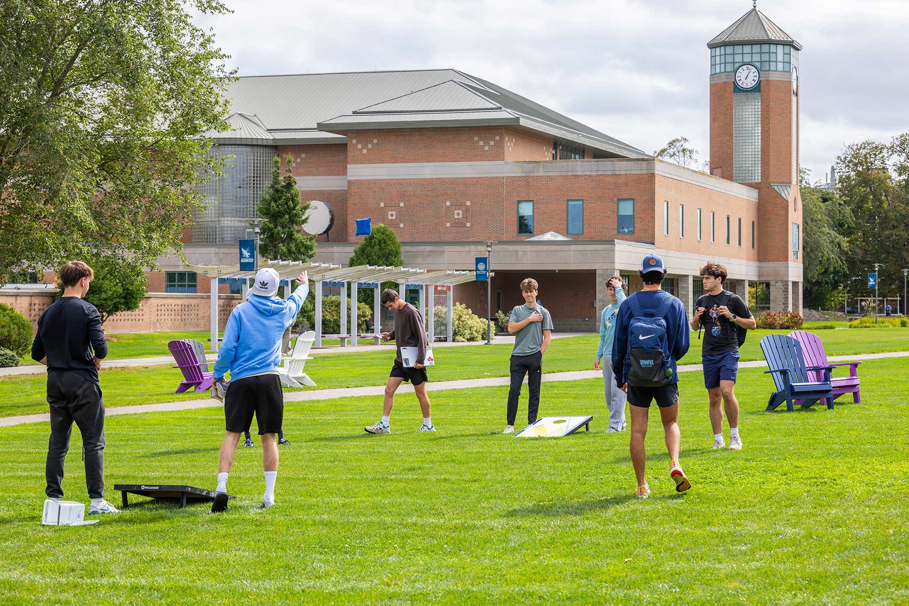 students playing ball games outside on campus
