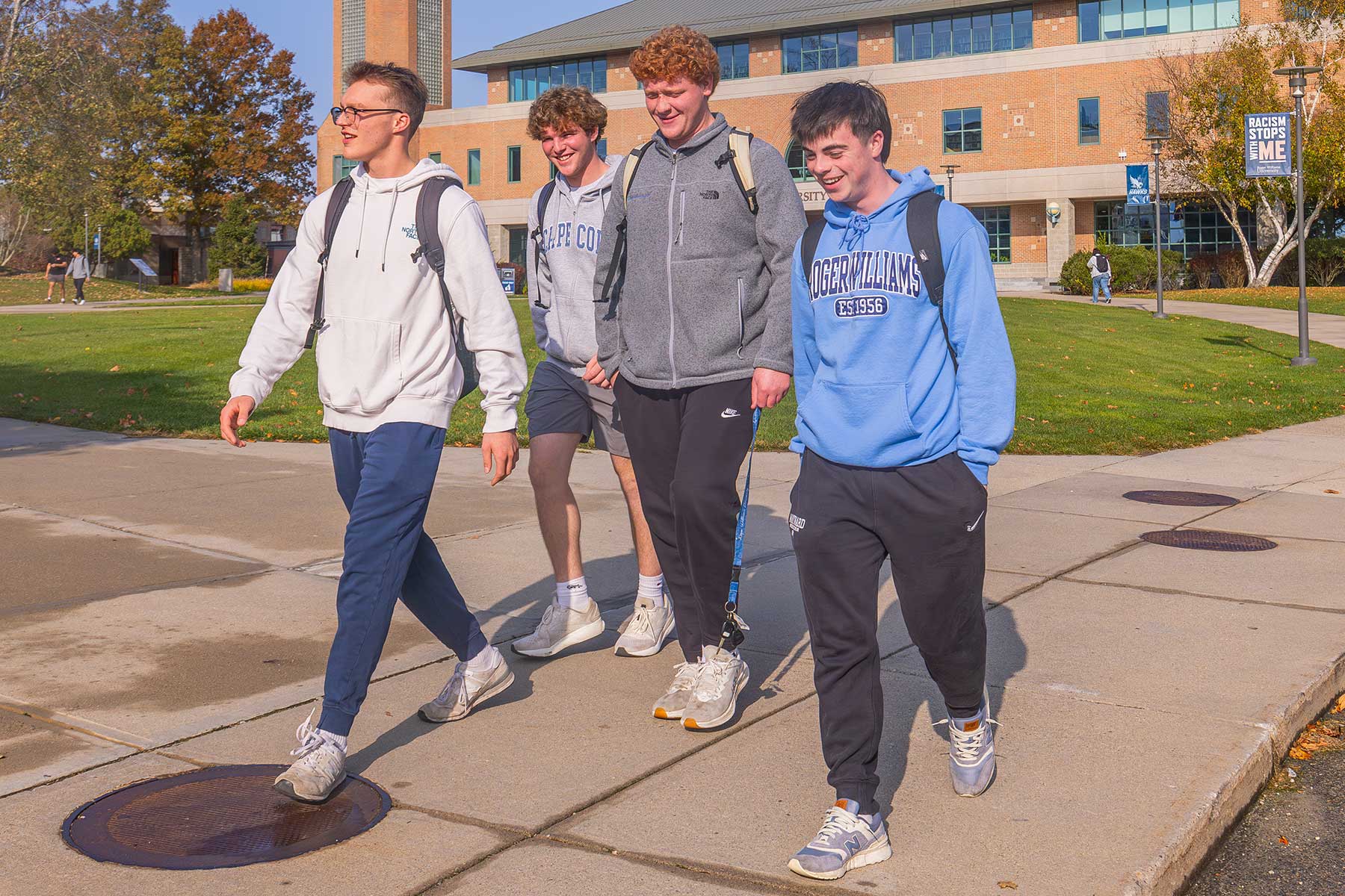 students walking on campus grounds