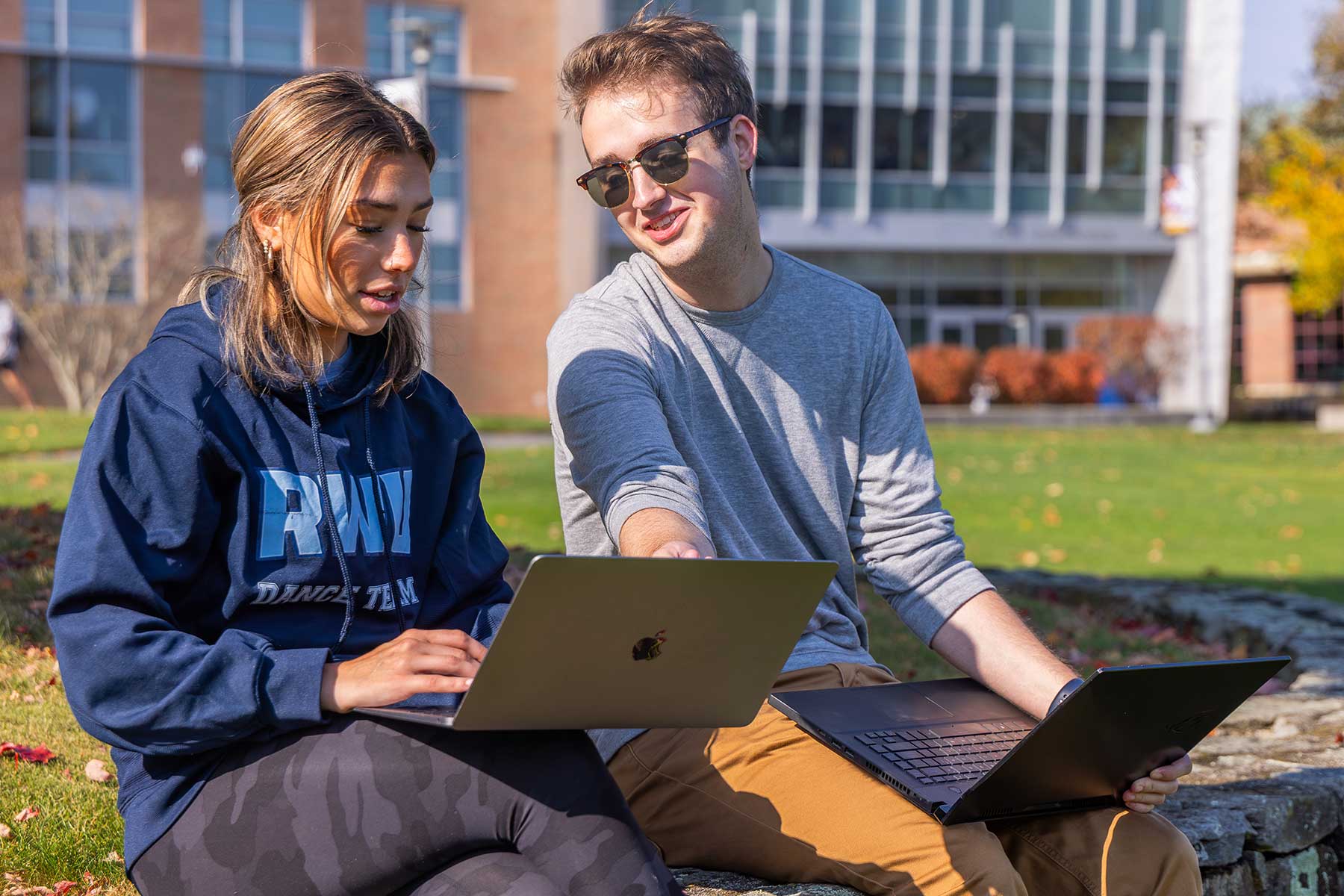 students sitting outside